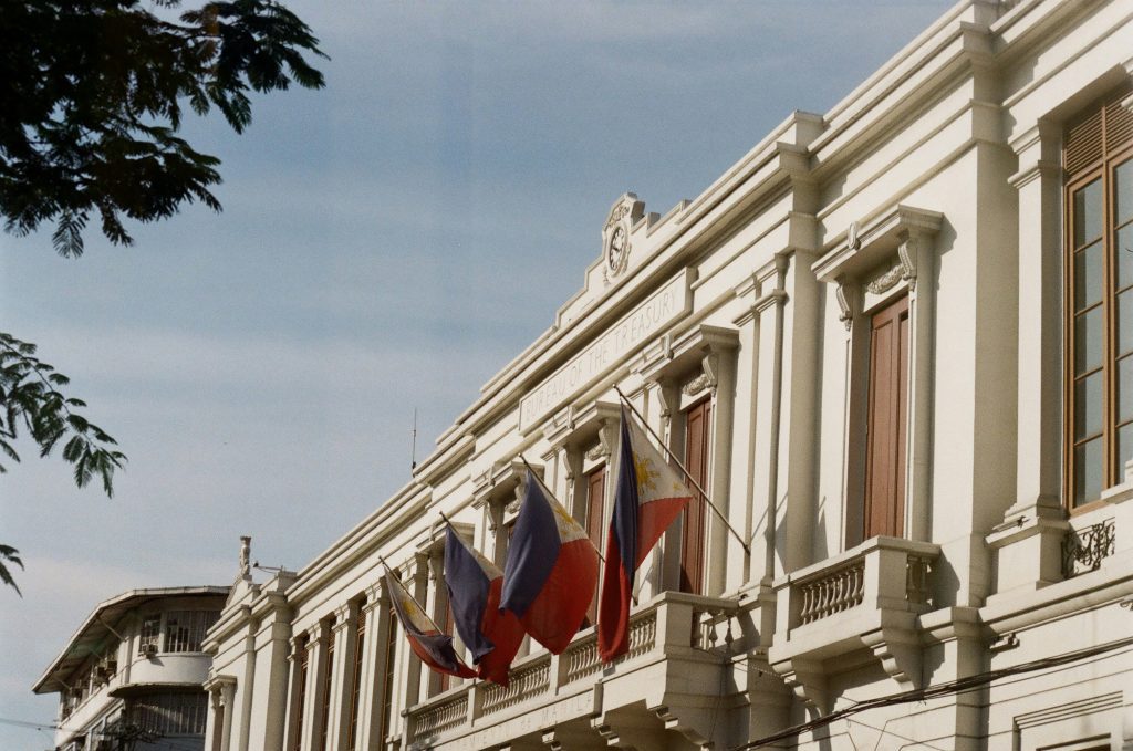 The Flag of the Philippines in front of the Bureau of the Treasury